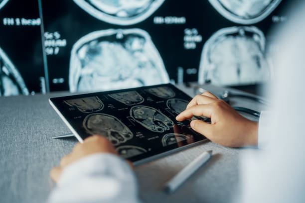 Doctor Looking CT examination image at Computer Monitor