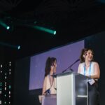 Woman standing at a podium