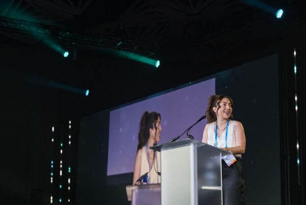 Woman standing at a podium