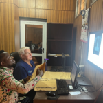 two men reviewing a radiograph in a reading room